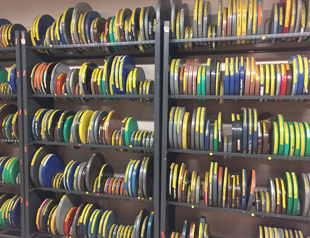 Collection of old films on a shelf