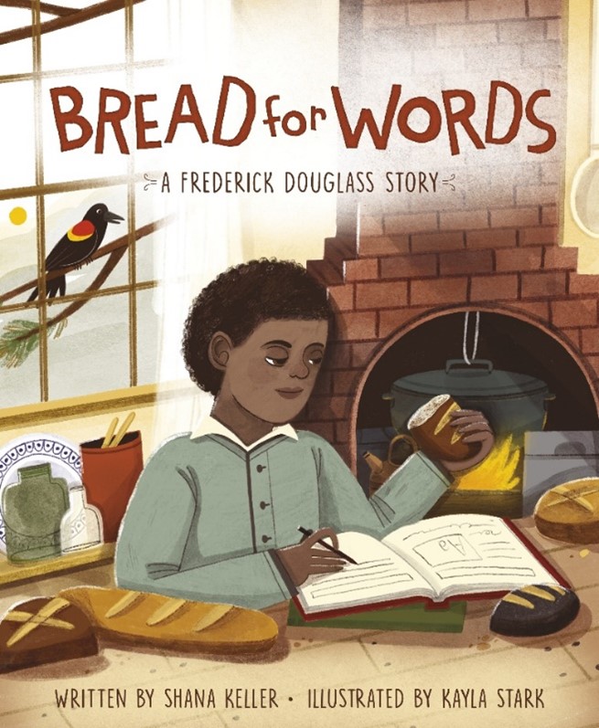 Child writing in book while holding bread