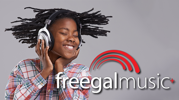 Close up of a girl dancing while listening to music through headphones