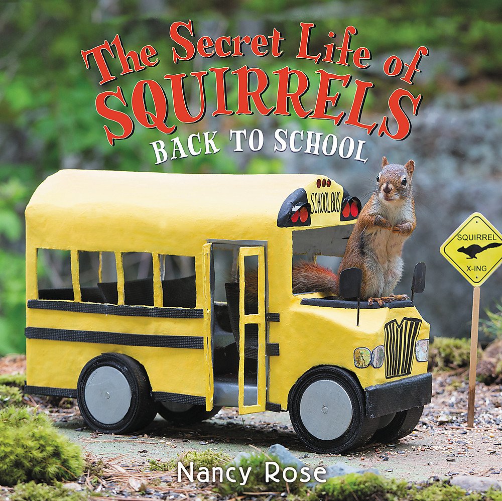 Photograph of a squirrel popping out of a miniature school bus